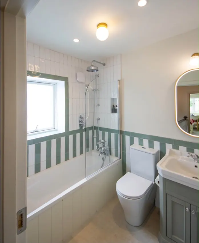 DIY SOS Bray: bathroom with bath, toilet and painted panelling