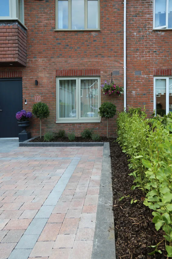 Front garden and path beside the completed home