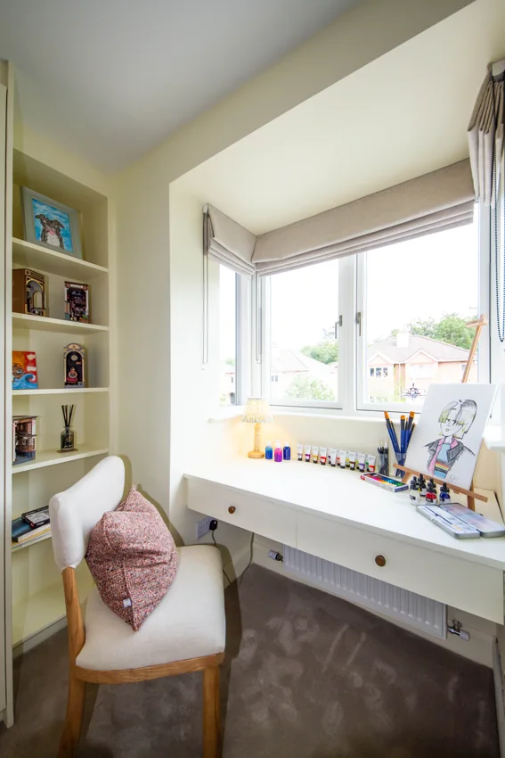 Dressing and work area beside a window