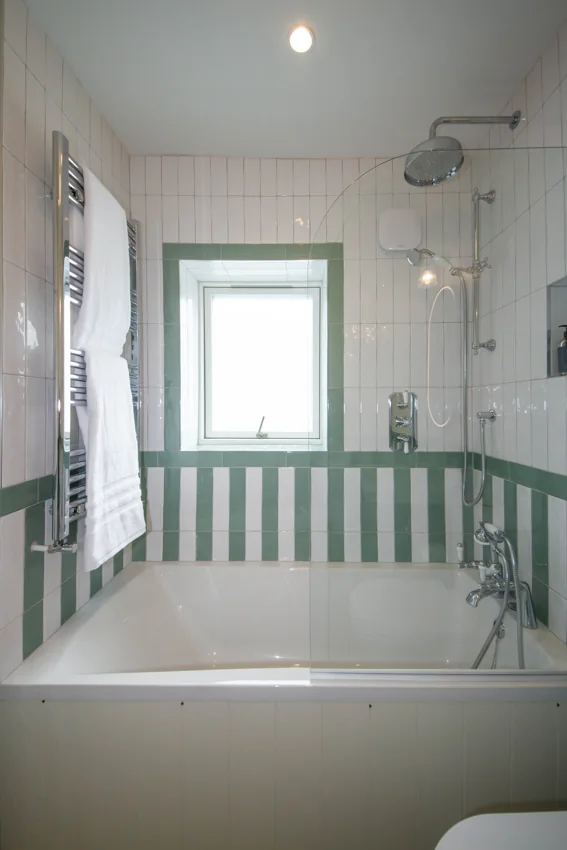 Completed room showing a cot and soft interior finishes