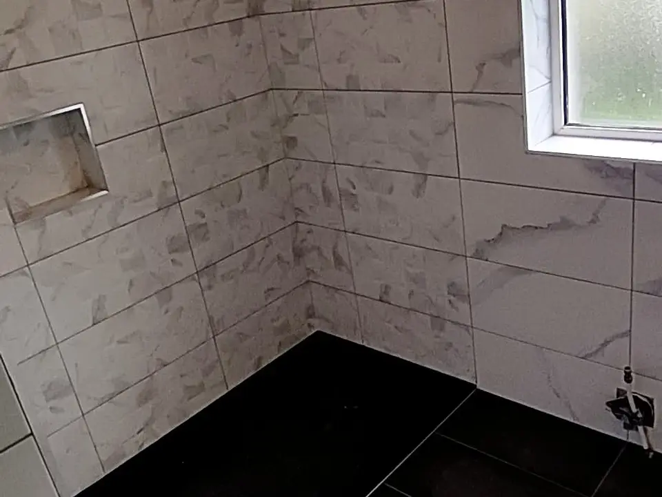 Bathroom wall tiling with recessed shower niche