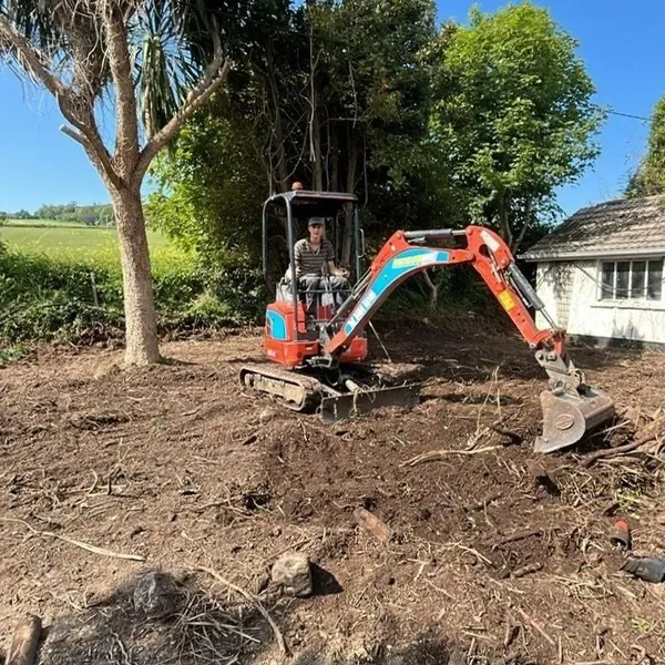 Excavator preparing a garden landscaping project