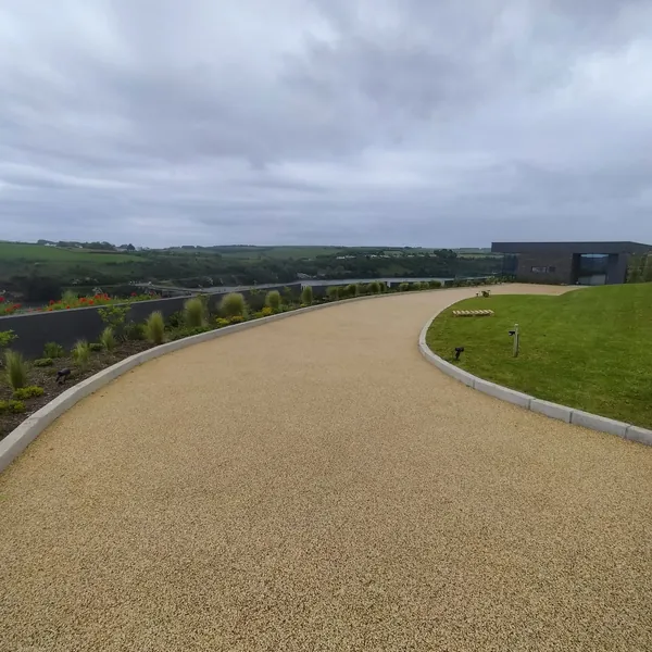 Resin-bound pathway and driveway through an open landscape