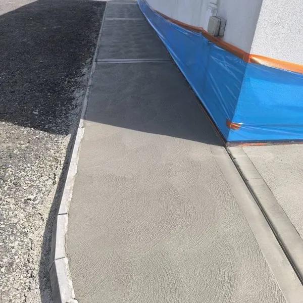 New pathway and resin paving at the side of a building