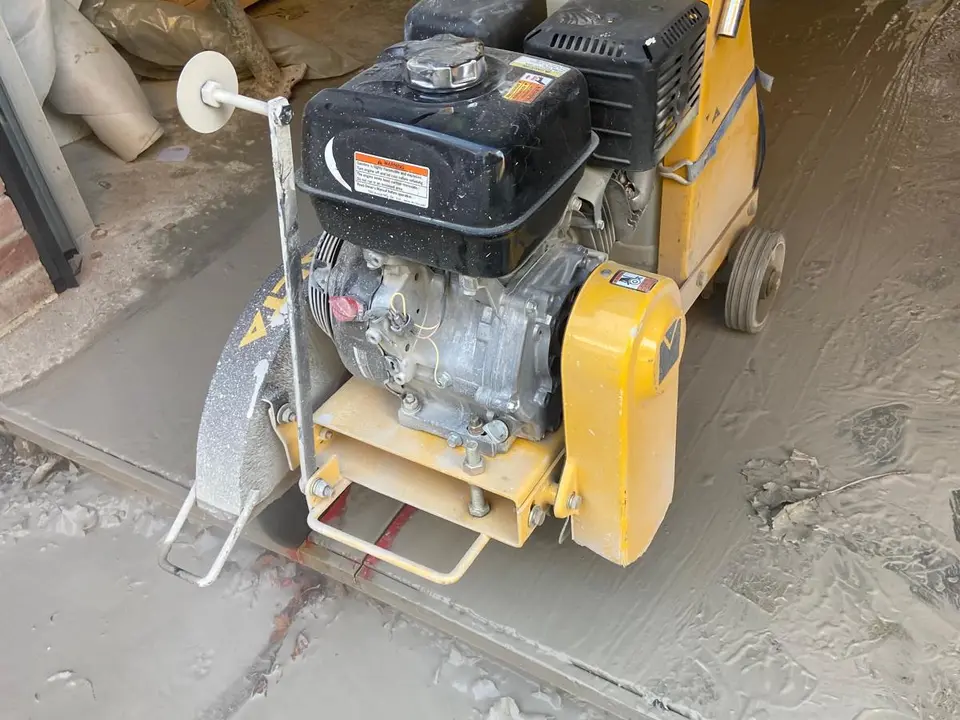 Diamond floor saw cutting a concrete slab