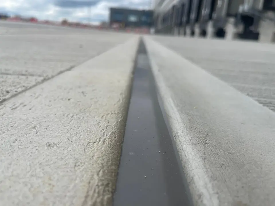 Close-up of a sealed concrete pavement joint by COPA