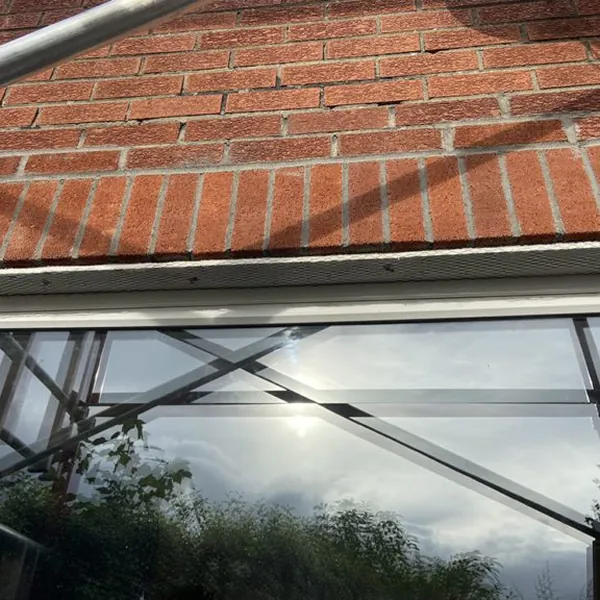 Lintel replacement and brick restoration above a window