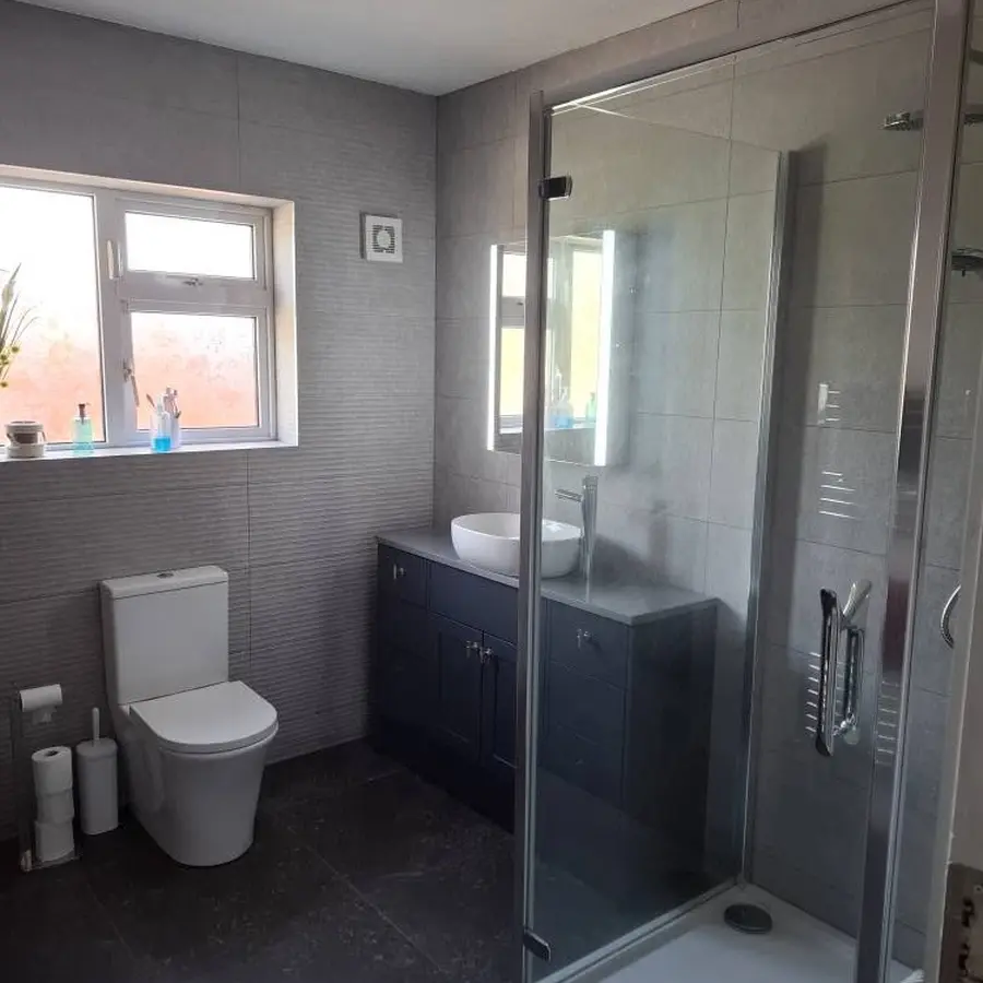 Completed bathroom refurbishment with shower enclosure