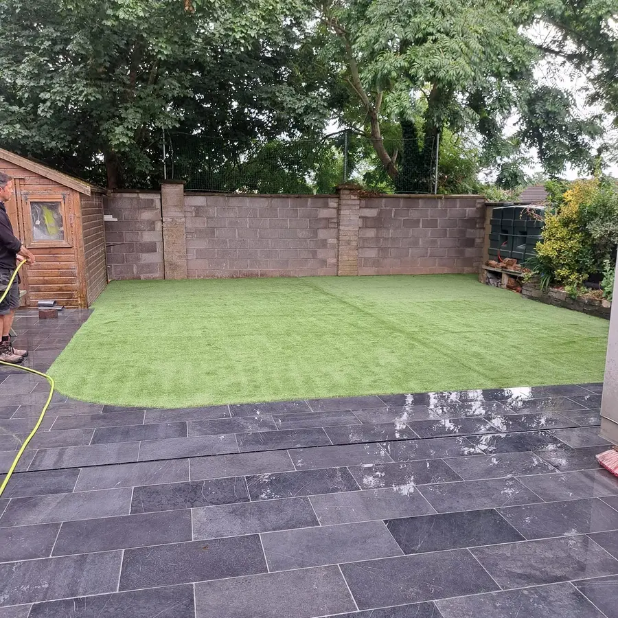 Landscaped rear garden with paving and artificial lawn