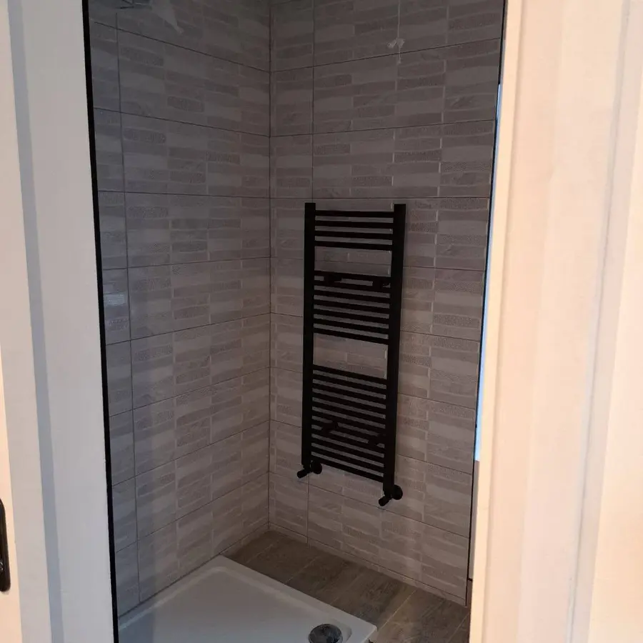 Tiled shower enclosure with modern fittings
