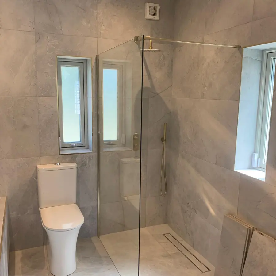 Completed tiled bathroom with walk-in shower