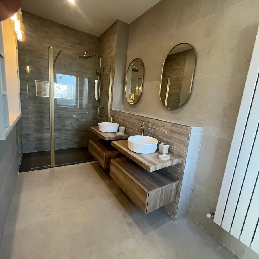 Completed modern bathroom with twin vanity units