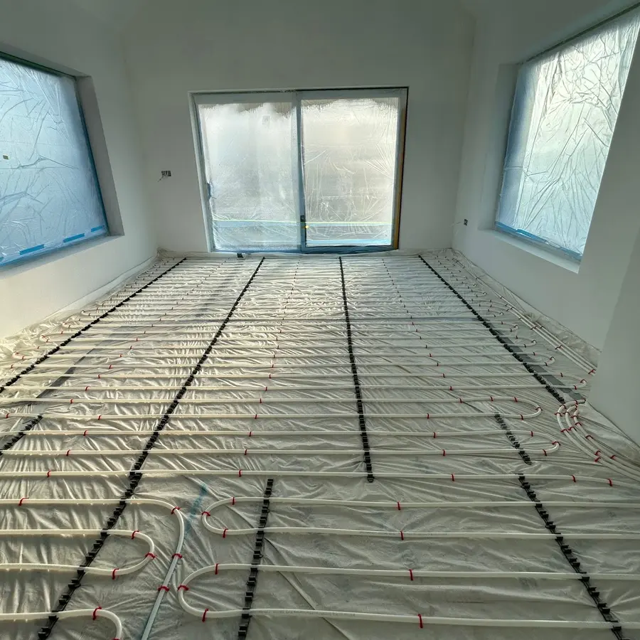 Underfloor-heating pipework installed across a living area