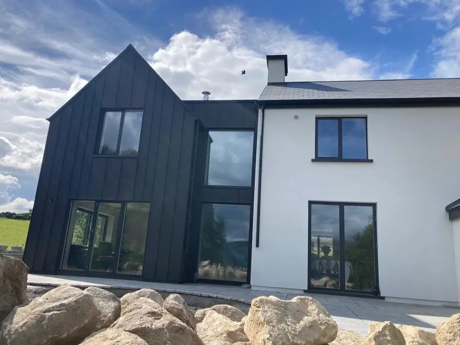 Completed house renovation with a dark feature gable