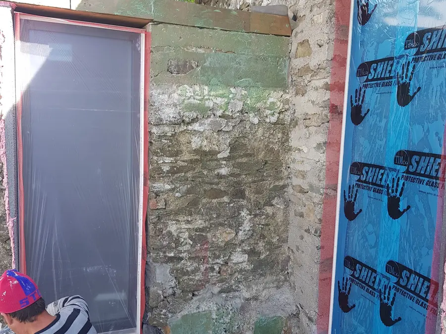 Exterior wall prepared for insulation and render