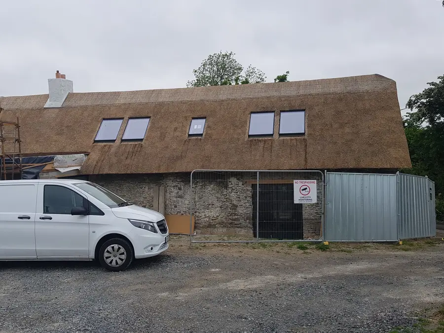 Restored traditional thatched cottage exterior