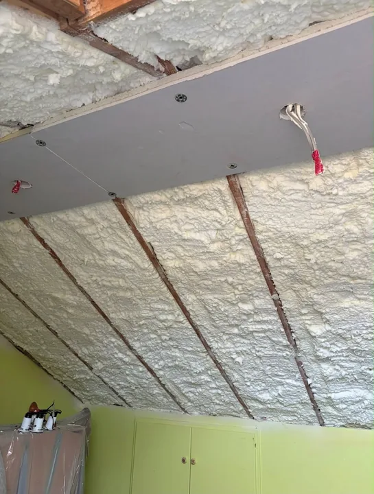 Spray foam insulation between ceiling joists — Innovate Insulation