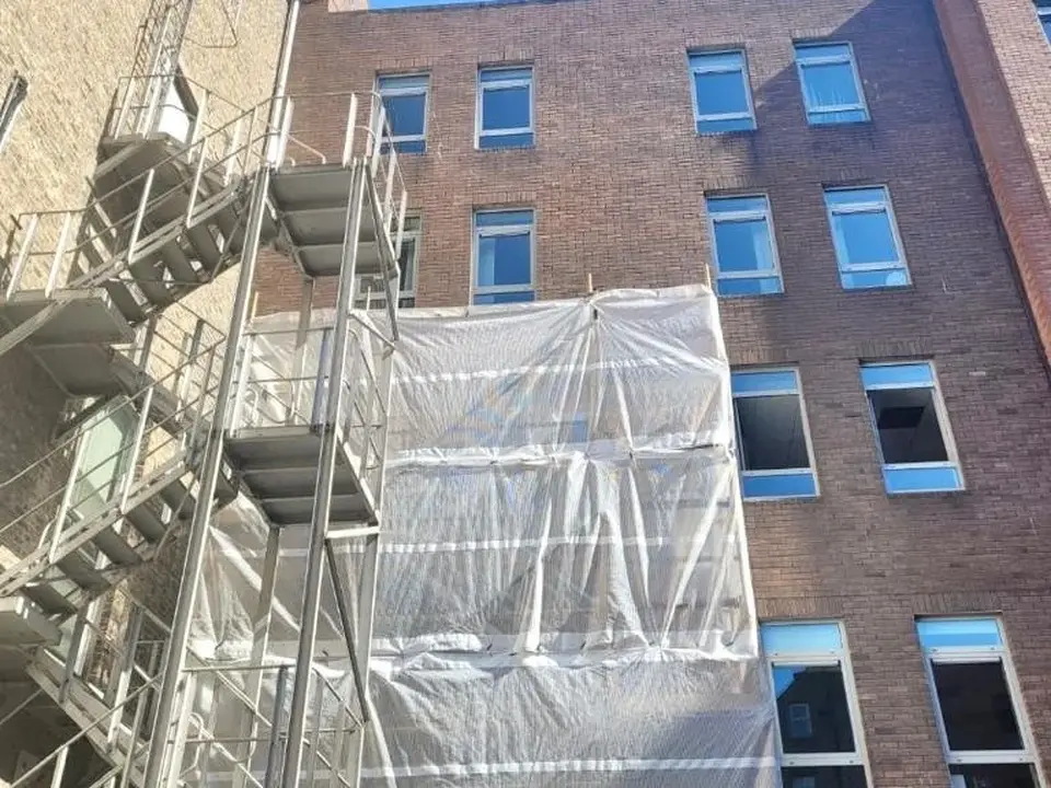 Irish Scaffolding Services scaffold and protective sheeting at a commercial building