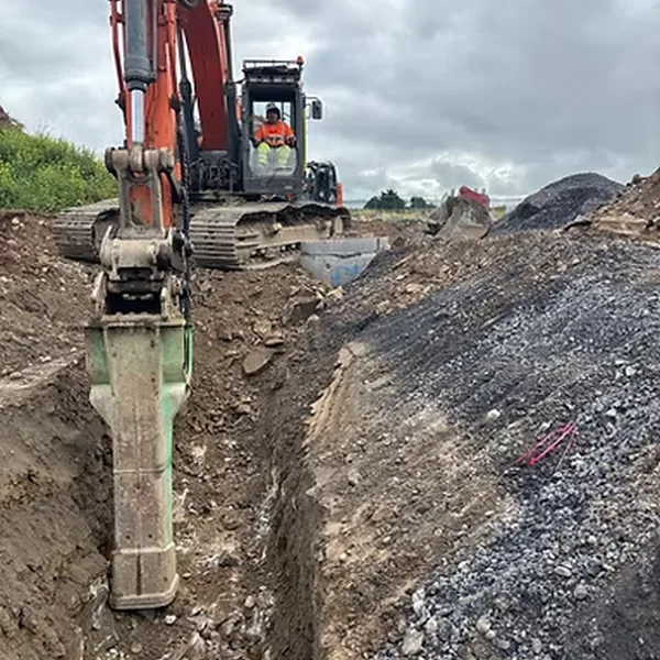 Tracked excavator undertaking civil engineering work