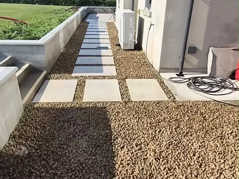 Landscaped gravel path with large paving slabs beside a Cork home