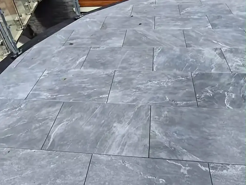 Grey porcelain patio paving installation
