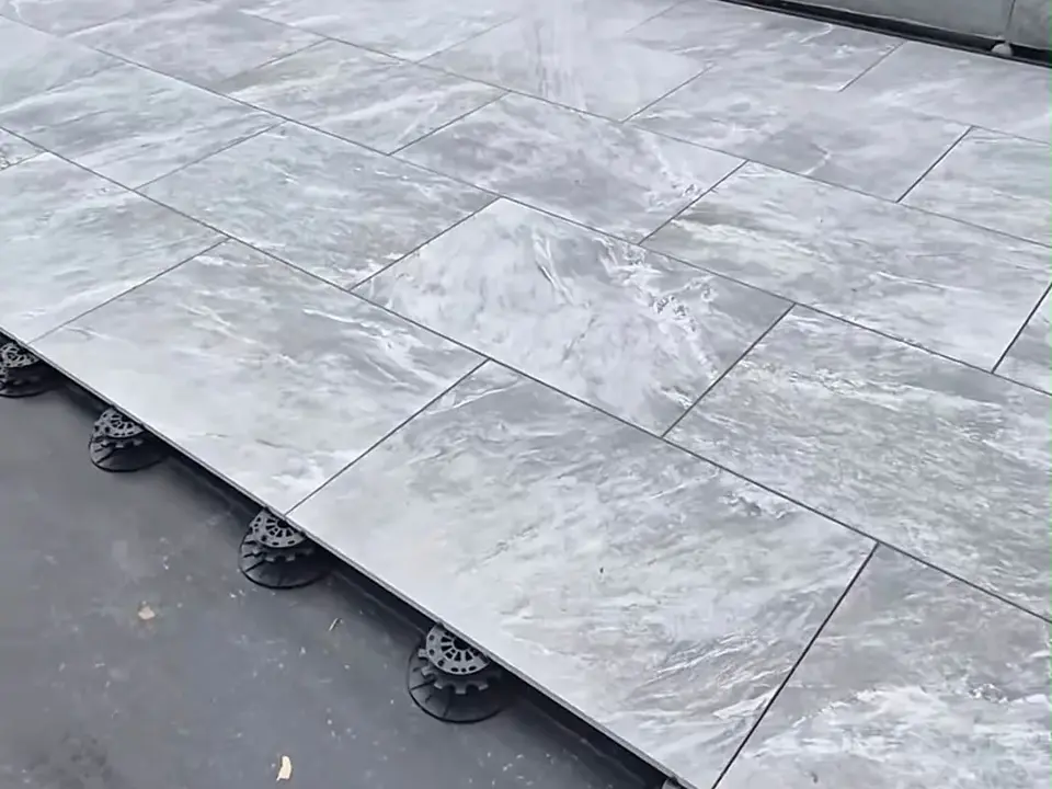Raised porcelain patio installation with pedestal supports