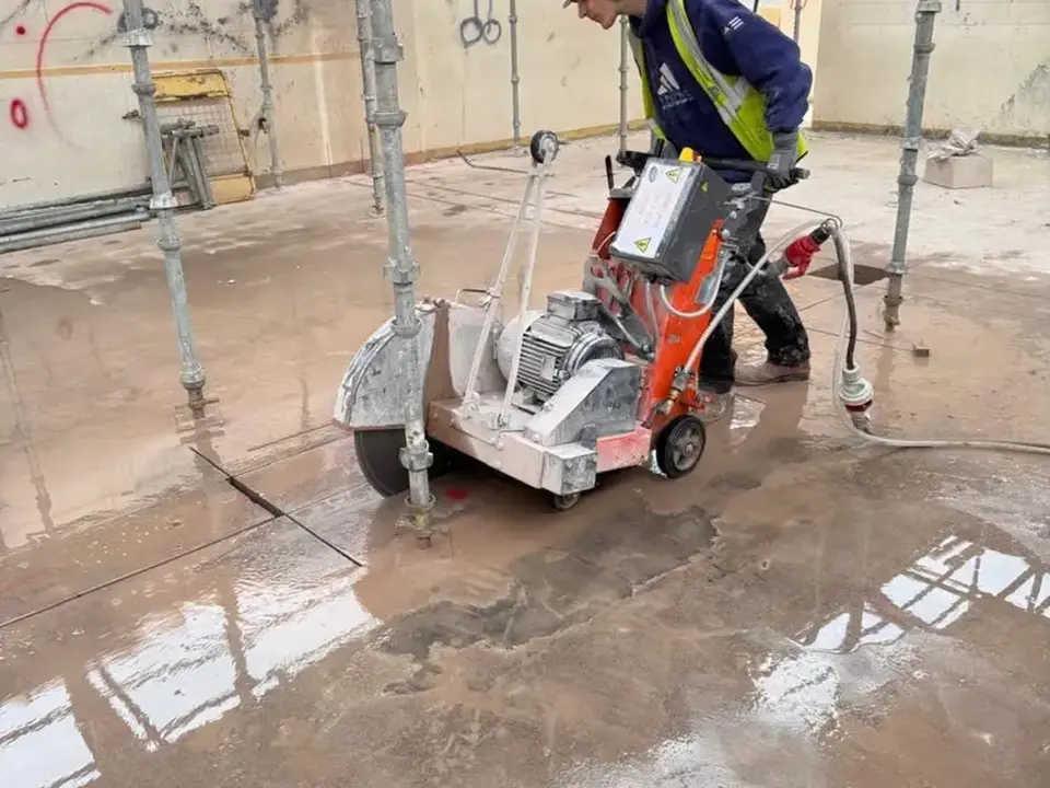 Floor sawing equipment cutting a concrete slab