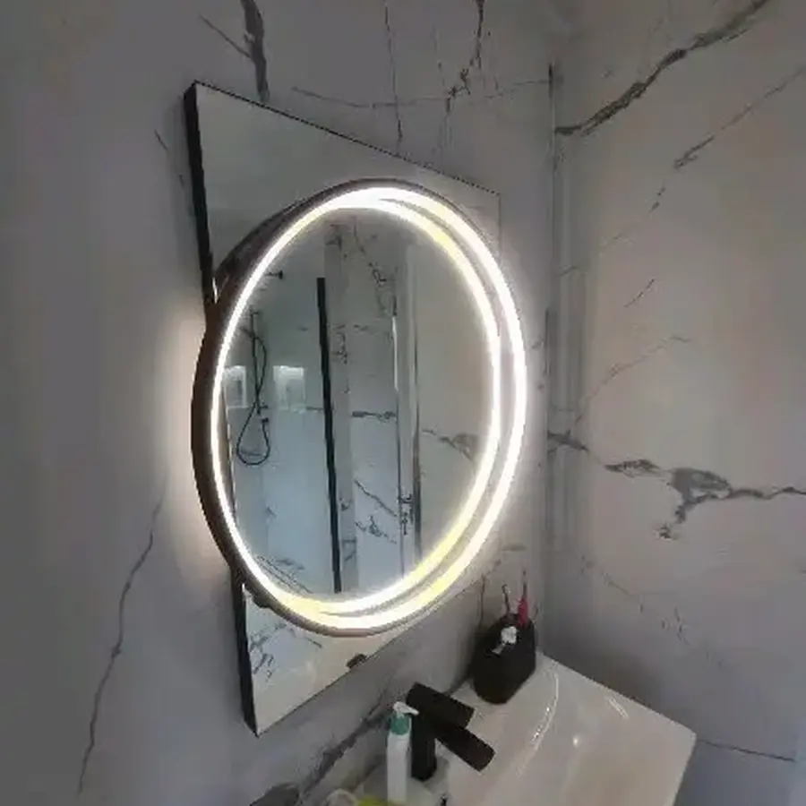 Marble-effect tiled bathroom vanity and illuminated mirror