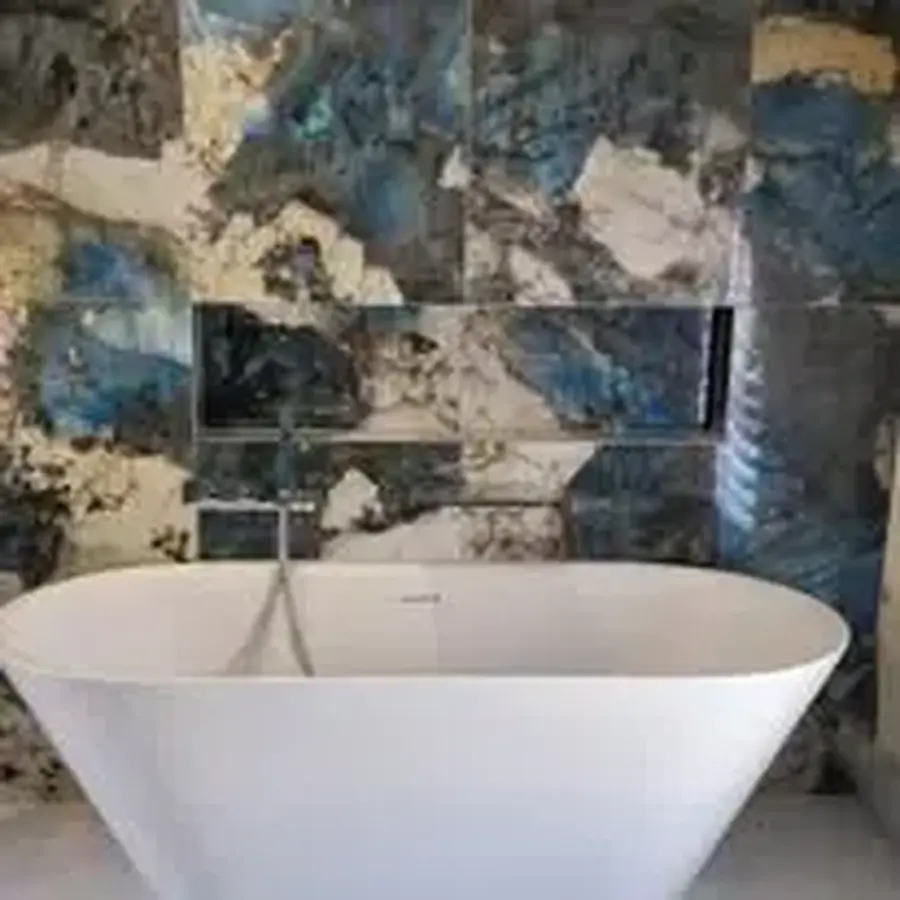 Completed tiled bathroom with freestanding bath