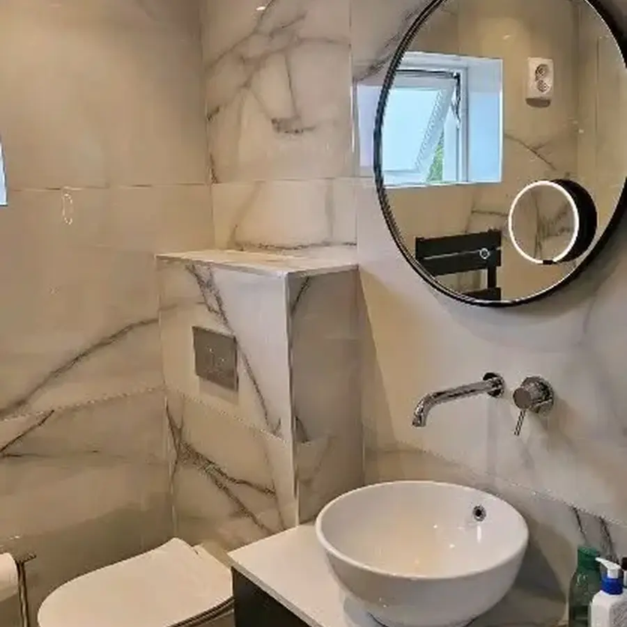 Finished bathroom tiling and vanity installation