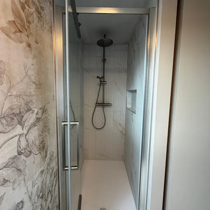 Completed rainfall shower enclosure and bathroom plumbing by PrimeLine Plumbing Solutions