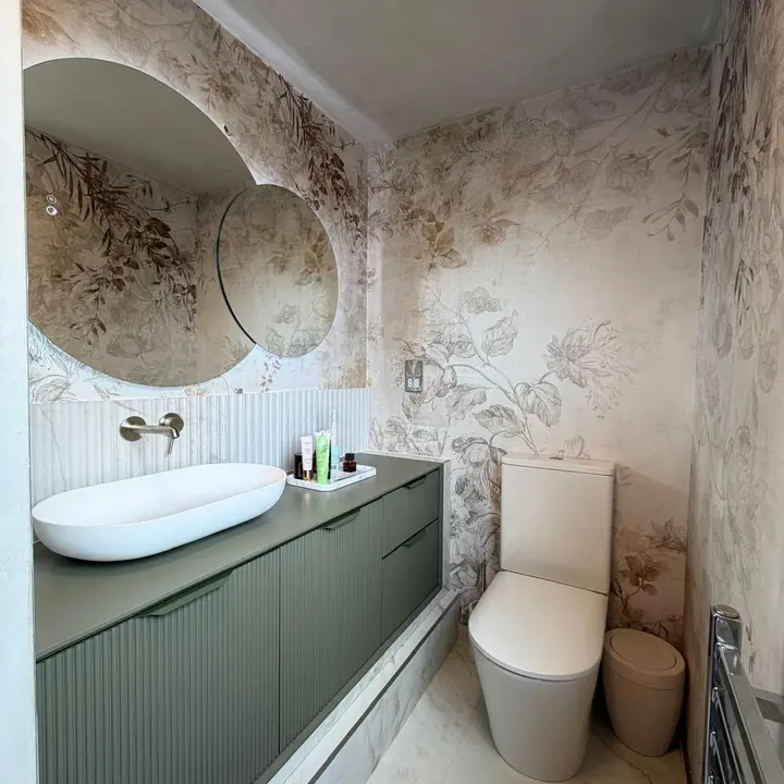 Finished bathroom vanity, basin and wall-mounted toilet installation by PrimeLine Plumbing Solutions