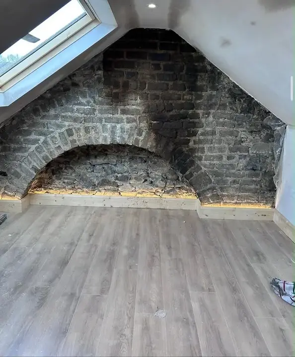 Attic brick feature wall before cleaning and repointing by Rigney Restoration