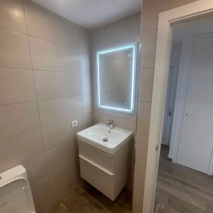 Illuminated bathroom mirror and ceiling lighting in the RP Electrical project gallery