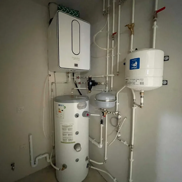 Hot water system installation with cylinder and pipework by PrimeLine Plumbing Solutions