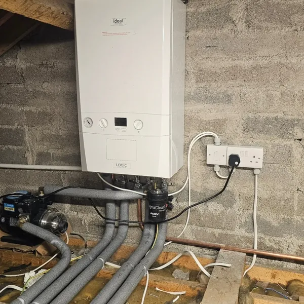 Installed boiler with plumbing and heating pipework