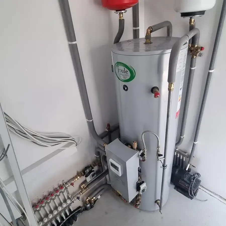 Installed hot-water cylinder, expansion vessels and heating controls