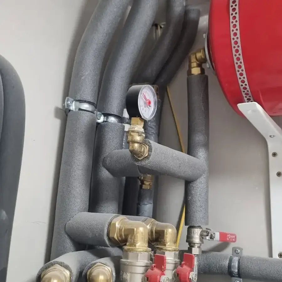Insulated heating pipework and expansion vessel installation